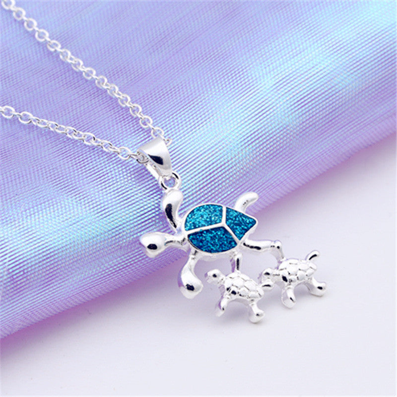 Fashionable Silver Pendant with Three Opal Tortoises